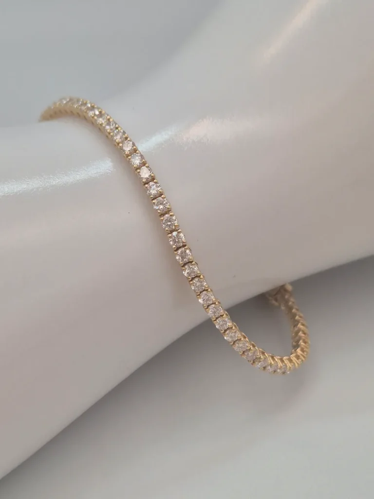 Bransoletka tenisowa 17 cm. żółte złoto 0.750 (18k) z diamentami laboratoryjnymi